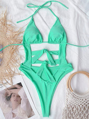 Sexy Solid Color Bandage Hollow One-Piece Swimsuit